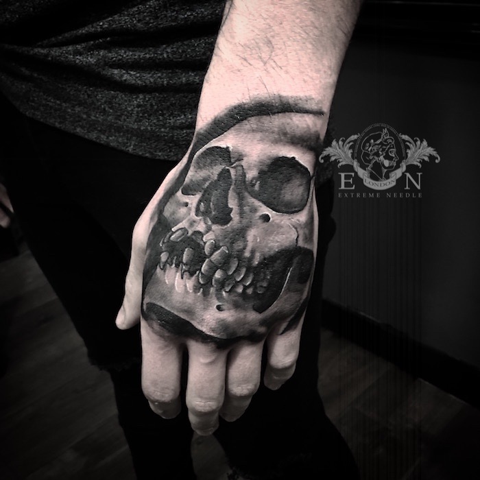 Skull on hand tattoo