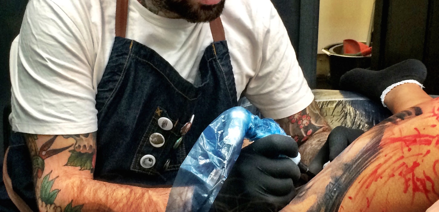 Tattoo Artist tattooing