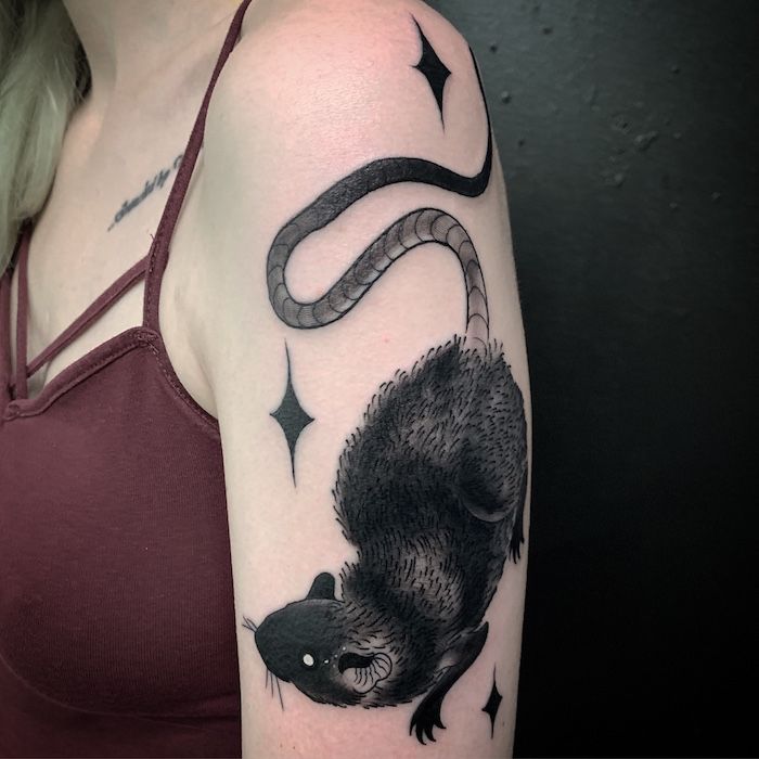A rat black and grey tattoo