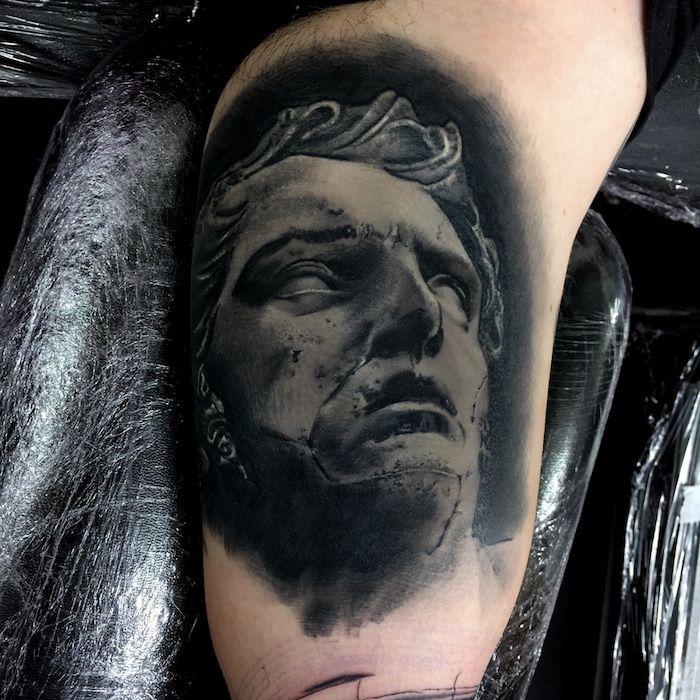 A black and grey face tattoo