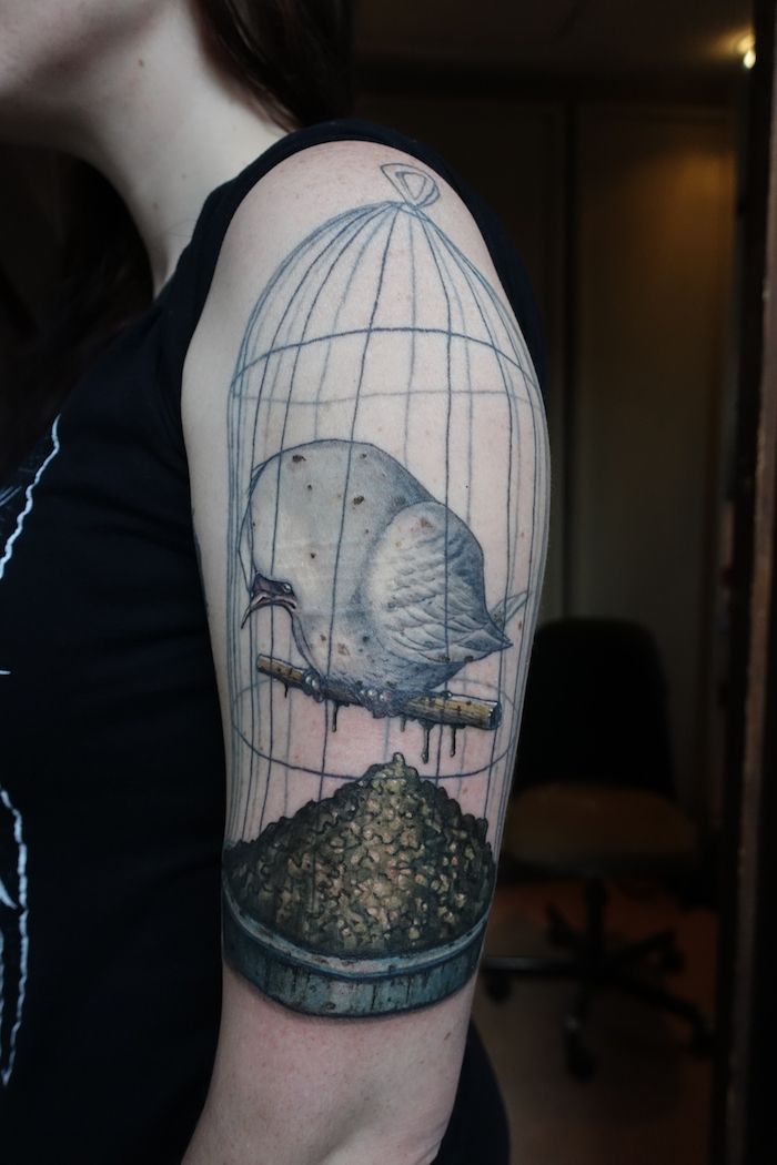 caged bird tattoo