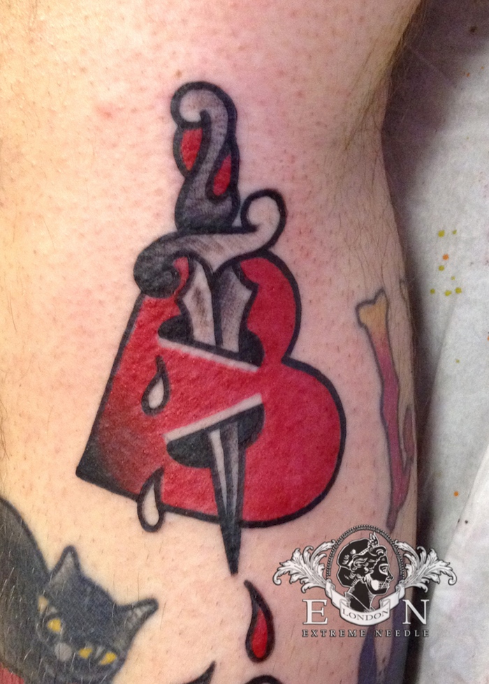 Dagger and heart tattoo