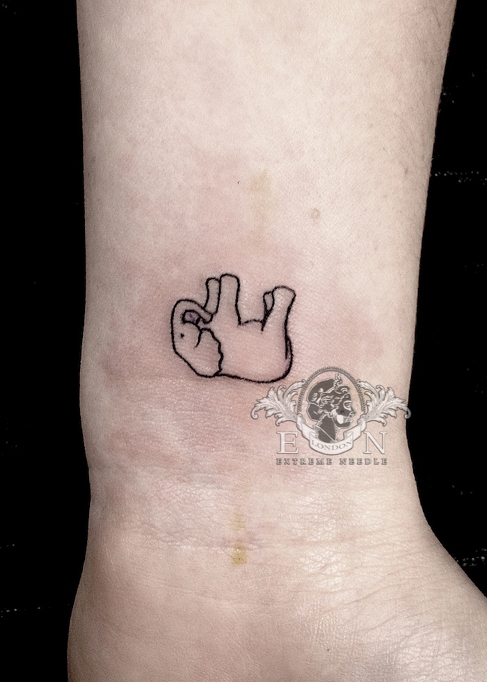 Dead elephant micro tattoo