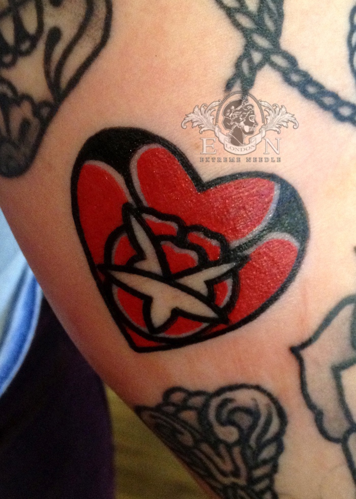Mini rose tattoo